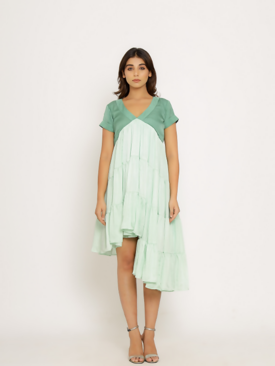 The Teal-Tea Green Mid Length Dress features elegant gathers and a striking asymmetrical high-low hemline. Perfect for any occasion, this dress effortlessly combines vibrant style with modern sophistication. – The Chic Indian